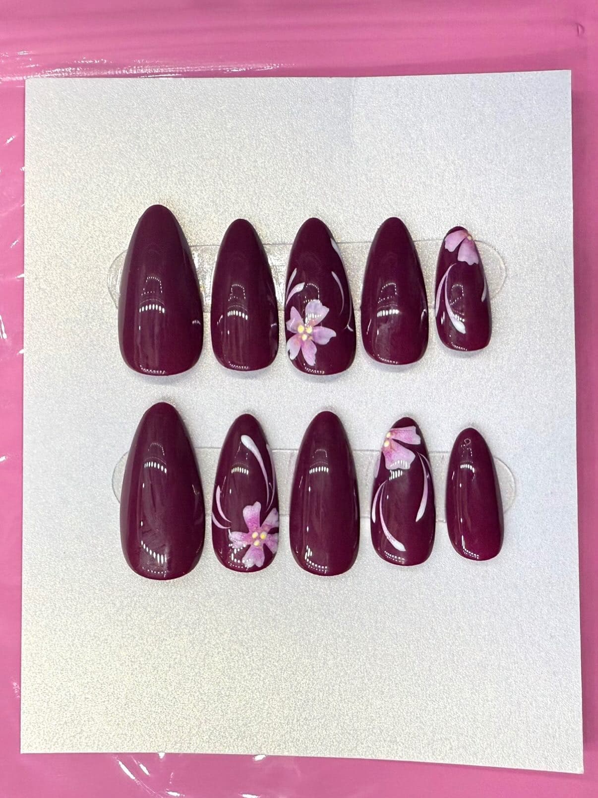 Dark magenta floral nails